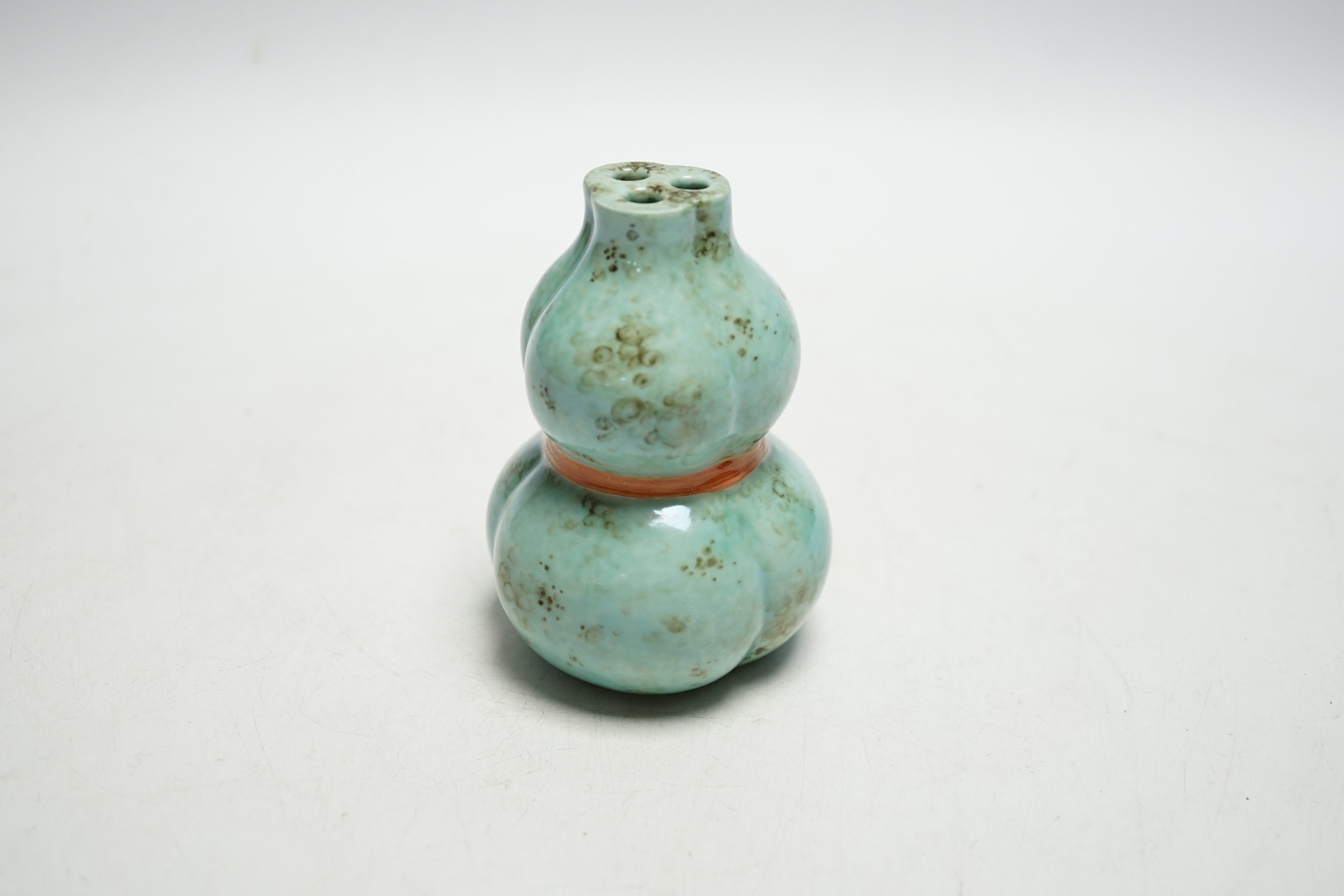 A Chinese enamelled porcelain gourd posy vase, 10cms high